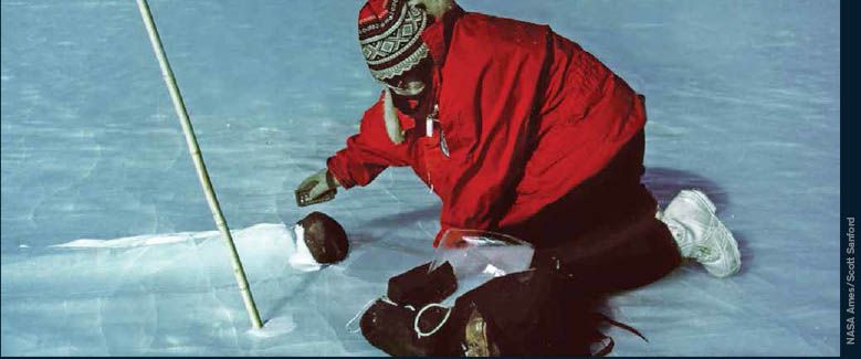 scientist investigating a meteorite in Antacrtica.
